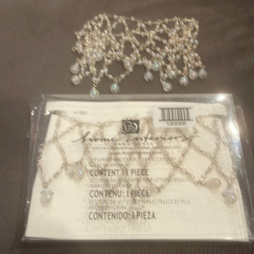 Home interiors candle accessory. One new in box - one without box. Both for 8$